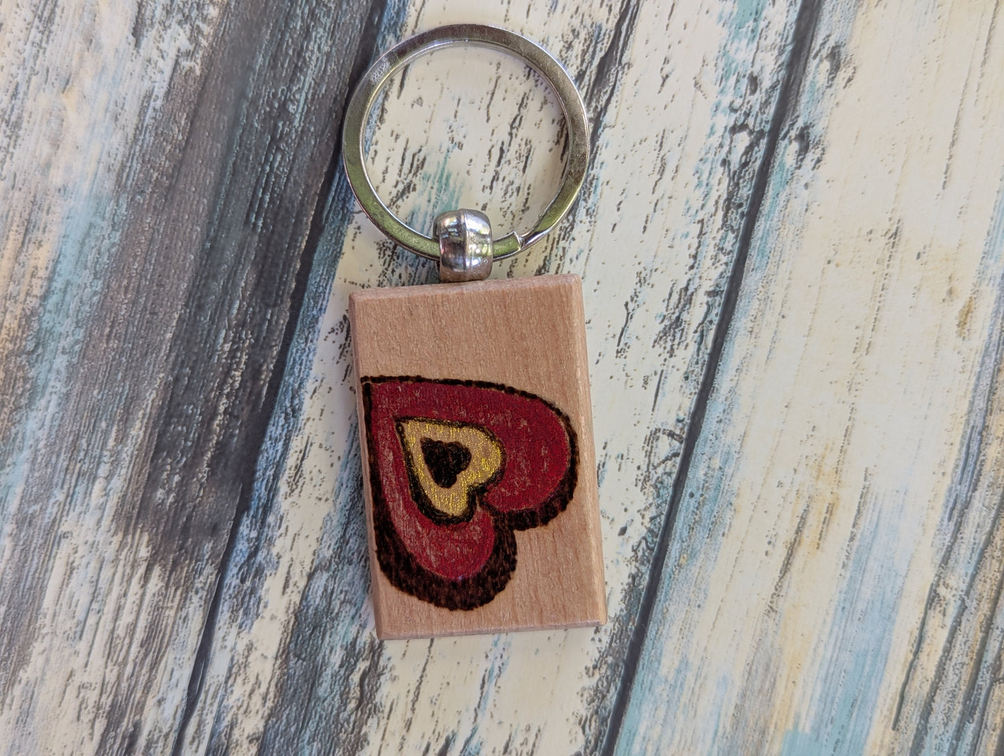 Handcrafted Pyrography Heart Keychain – With a Touch of Color
